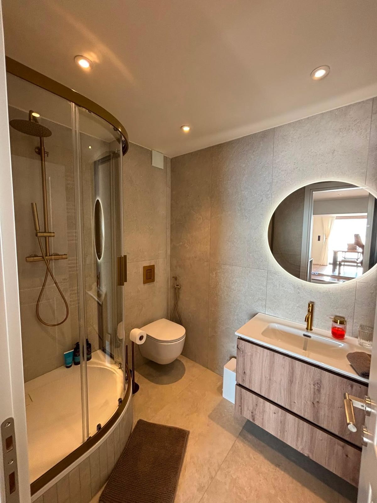 One of the three bathrooms, with a walk-in shower.